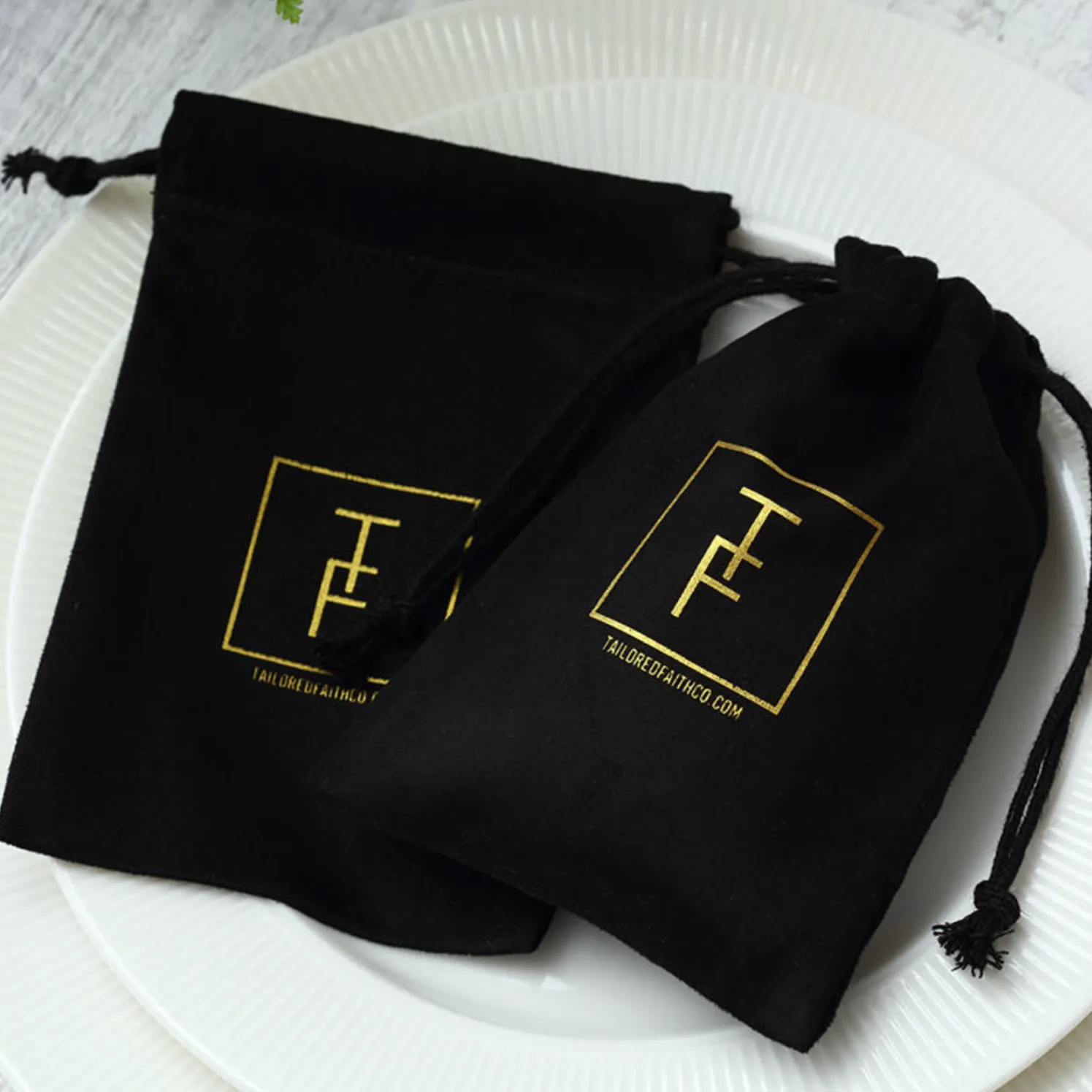 100 black pouches with custom design